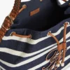 Bolso tipo cubo con rayas bretonas y monograma en letra cursiva