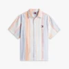 Camisa de rayas de tejido dobby de corte holgado de Tommy Jeans Camisa de rayas de tejido dobby de corte holgado de Tommy Jeans