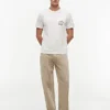 Camiseta con bolsillo y logotipo floral