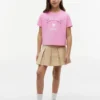 Camiseta infantil con el logotipo de Tommy y pedrería Camiseta infantil con el logotipo de Tommy y pedrería