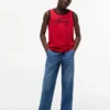 Camiseta sin mangas para niños con el logotipo de Tommy en letra cursiva