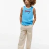 Camiseta sin mangas para niños con el logotipo de Tommy en letra cursiva