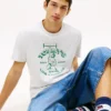 Camiseta Tommy Jeans con el logotipo del levantador de pesas Camiseta Tommy Jeans con el logotipo del levantador de pesas