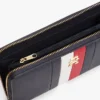 Cartera con cremallera y rayas distintivas Cartera con cremallera y rayas distintivas