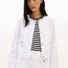 Chaqueta vaquera de mujer con botones dorados Chaqueta vaquera de mujer con botones dorados