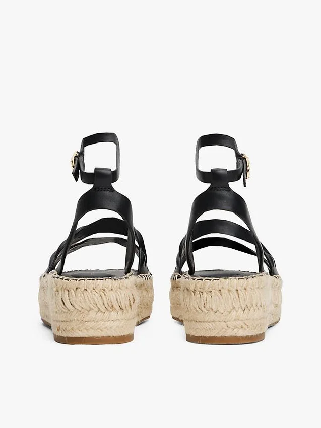 Espadrillas con plataforma y tiras retorcidas de cuero Espadrillas con plataforma y tiras retorcidas de cuero