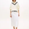 Falda midi vaquera con bolsillos y botones dorados