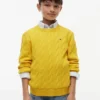 Jersey de punto trenzado para niña