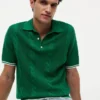Jersey polo de punto trenzado de manga corta Jersey polo de punto trenzado de manga corta