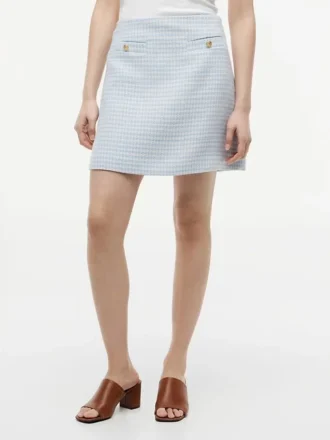 Minifalda de tweed con botones dorados