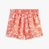 Pantalones cortos con volantes y estampado tropical para niña