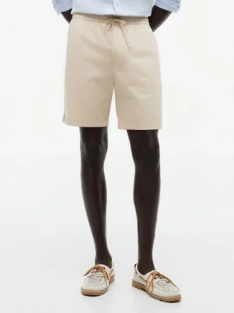 Pantalones cortos de corte regular de 18 cm con lavado a la prenda