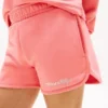 Pantalones cortos infantiles con logo Tommy y purpurina