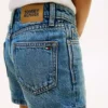 Pantalones cortos vaqueros ajustados para niña Pantalones cortos vaqueros ajustados para niña
