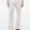 Pantalones holgados con pliegues y tacto de papel Pantalones holgados con pliegues y tacto de papel
