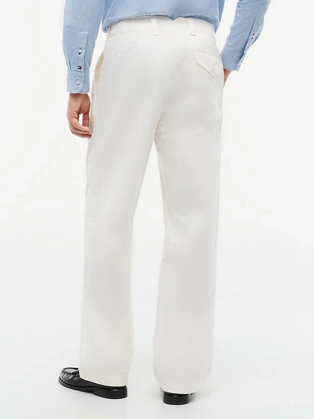 Pantalones holgados con pliegues y tacto de papel Pantalones holgados con pliegues y tacto de papel