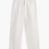 Pantalones holgados con pliegues y tacto de papel Pantalones holgados con pliegues y tacto de papel