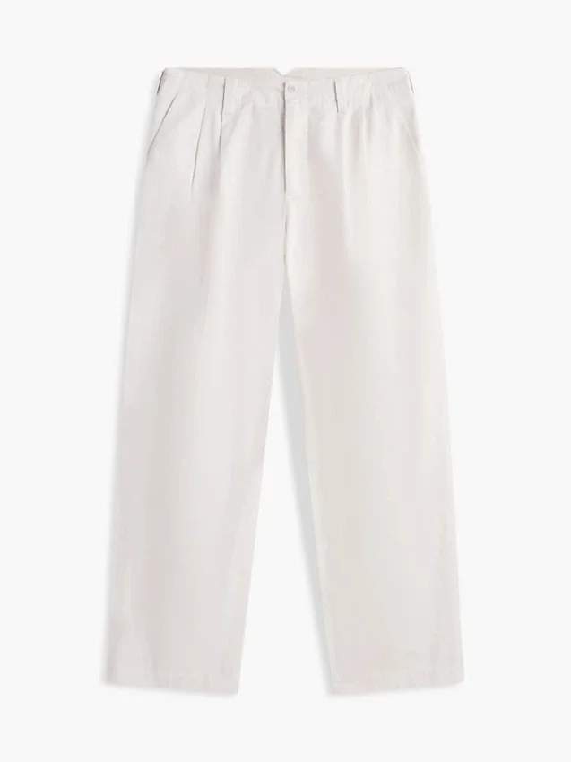 Pantalones holgados con pliegues y tacto de papel Pantalones holgados con pliegues y tacto de papel