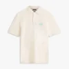 Polo con palmera bordada de corte clásico