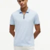 Polo de algodón liso con cremallera de corte regular