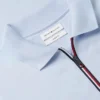 Polo de algodón liso con cremallera de corte regular