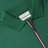Polo de algodón liso con cremallera de corte regular