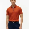 Polo de algodón liso con cremallera y corte regular