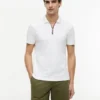 Polo de algodón liso con cremallera y corte regular