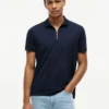 Polo de algodón liso con cremallera y corte regular