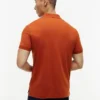 Polo de algodón liso con cremallera y corte regular
