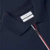 Polo de algodón liso con cremallera y corte regular