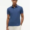 Polo de corte entallado con ribetes
