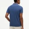 Polo de corte entallado con ribetes