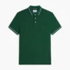 Polo de corte entallado con ribetes