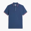 Polo de corte entallado con ribetes