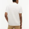 Polo de corte regular con bolsillo de malla