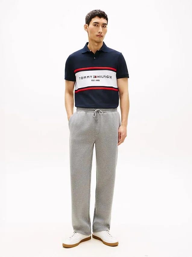 Polo de corte regular con rayas y logotipo de Tommy Polo de corte regular con rayas y logotipo de Tommy