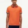 Polo de corte regular con ribetes y tejido transpirable