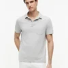 Polo de jersey con bolsillo y corte regular