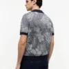 Polo de manga corta con estampado tropical