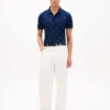Polo de piqué con estampado de banderas en todo el cuerpo y corte regular Polo de piqué con estampado de banderas en todo el cuerpo y corte regular