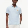 Polo de piqué con monograma en letra cursiva y corte regular