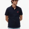Polo de piqué con monograma en letra cursiva y corte regular