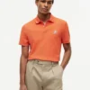 Polo de piqué con monograma en letra cursiva y corte regular