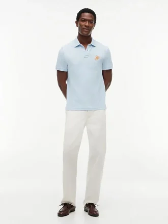 Polo de piqué con monograma en letra cursiva y corte regular
