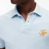 Polo de piqué con monograma en letra cursiva y corte regular