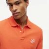 Polo de piqué con monograma en letra cursiva y corte regular
