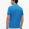 Polo de piqué con monograma en letra cursiva y corte regular