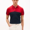 Polo de piqué con rayas en bloques de color y corte regular Polo de piqué con rayas en bloques de color y corte regular