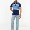 Polo de piqué elástico con rayas anchas y corte entallado Polo de piqué elástico con rayas anchas y corte entallado